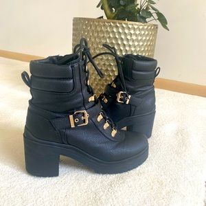Guess black leather heeled combat boots with gold buckle and detailing. 8.5